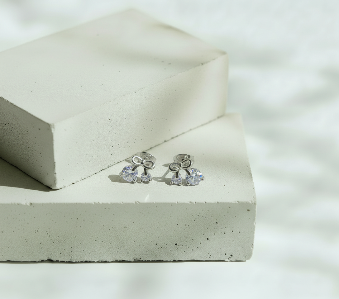 Aretes Plateados Moñito y Mini Brillo - Acero Inoxidable