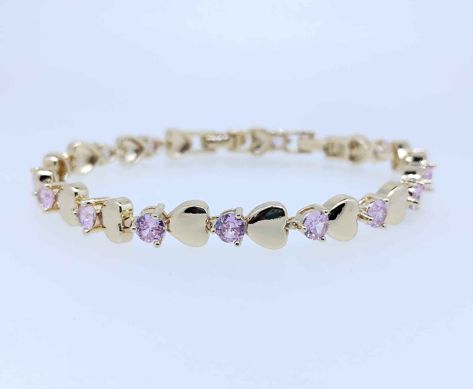 Pulsera Acero Corazones Dorados y Piedritas color rosa