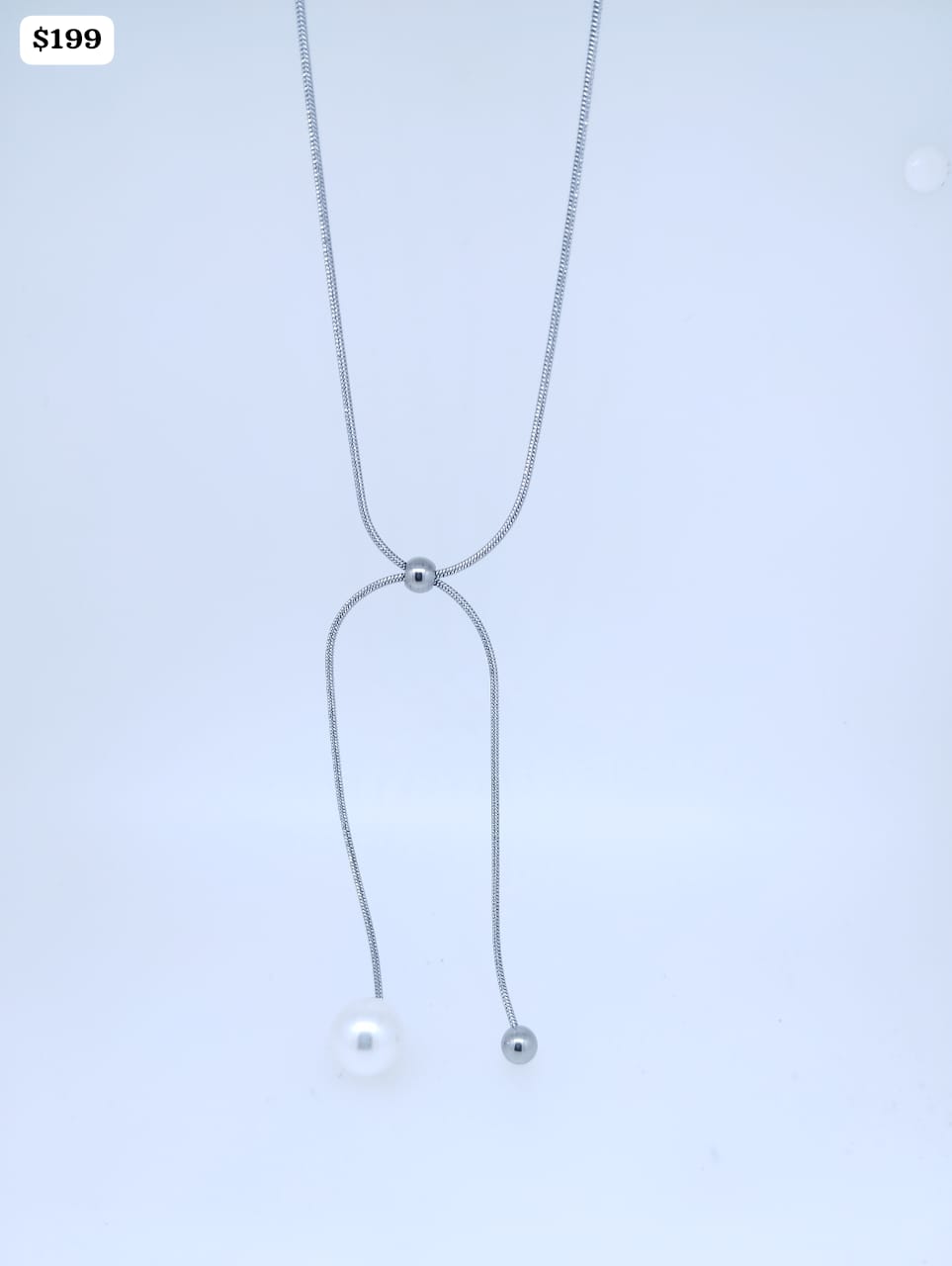 Cadenita Acero color plata tipo corbatero con 1 bolita color perla y 1 color plata