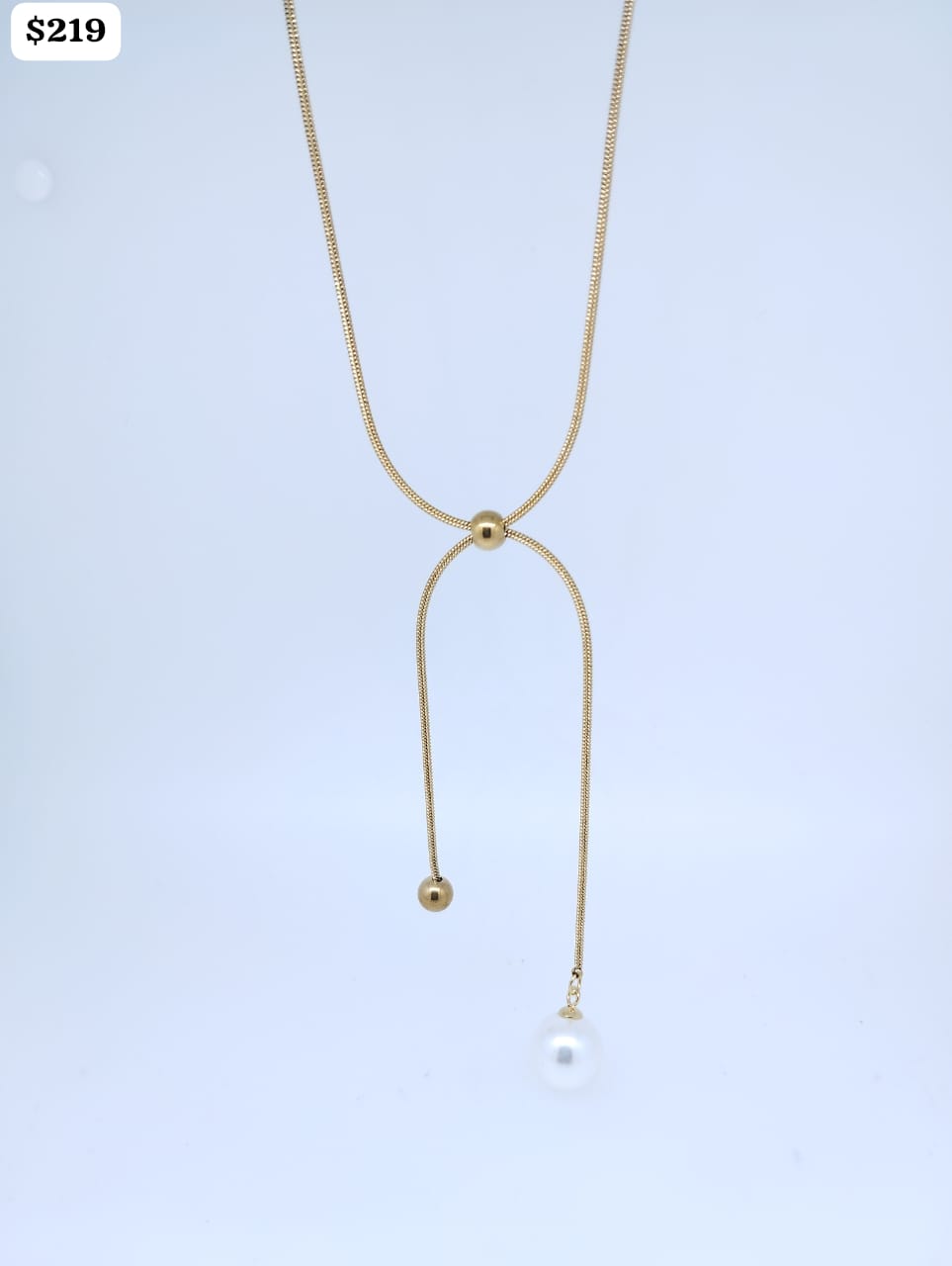 Cadenita Acero color dorado tipo corbatero con 1 bolita color perla y 1 color dorado